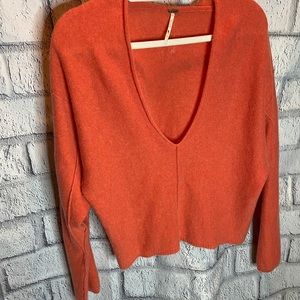 Free people cashmere orange V-neck crop sweater.